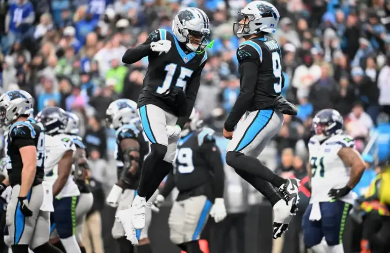 Carolina Panthers quarterback Bryce Young celebrates a fourth-quarter touchdown with receiver Jimmy Horn Jr.